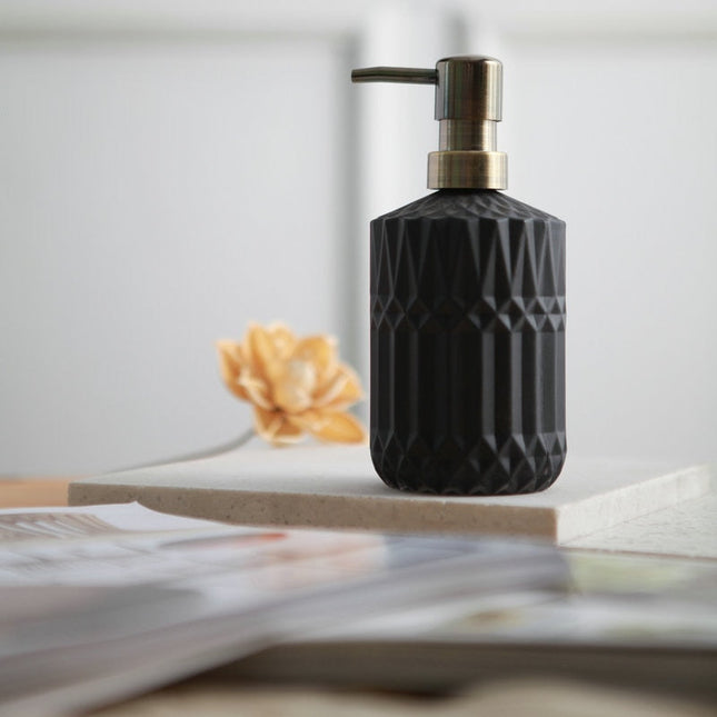 Zwarte glazen zeepdispenser met reliëf