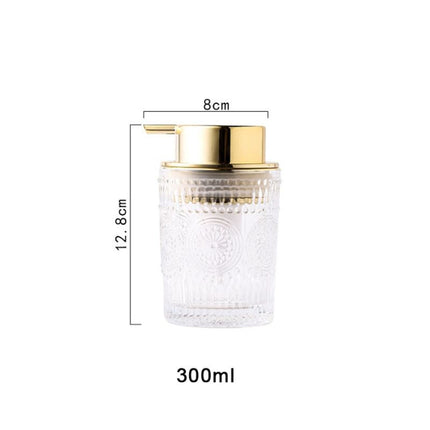 Glazen zeepdispenser met gouden pomp